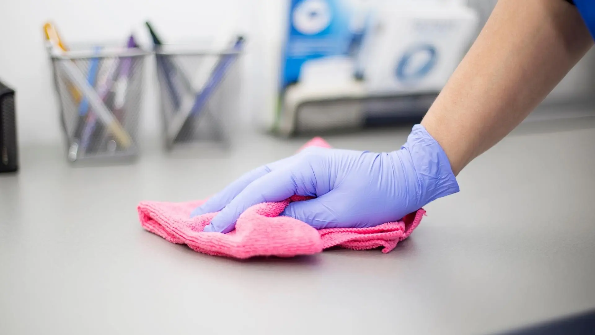 Hands wiping counter